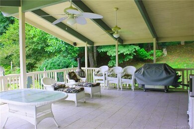 Main level side covered deck with tile floors, cei