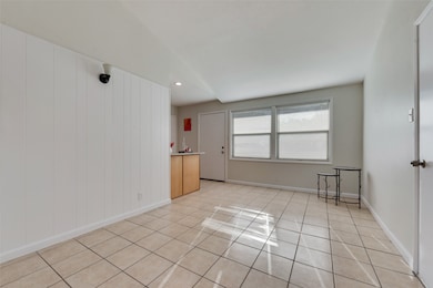 Unfurnished room featuring light tile patterned flooring and recessed lighting