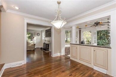 Dining Room with half wall, recessed lights & crow