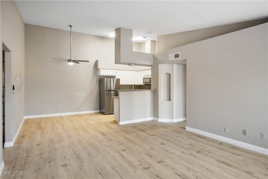 Unfurnished living room featuring light wood finis