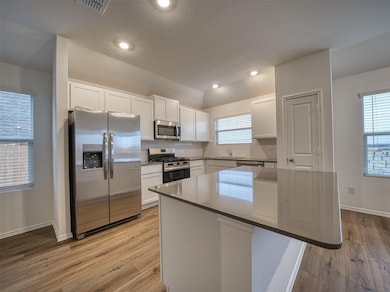 Kitchen with appliances with stainless steel fini