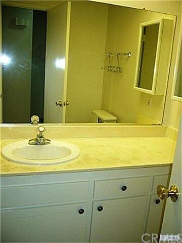 Hallway bathroom with a shower.