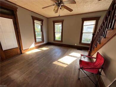 Spare room with a wealth of natural light, hardwoo