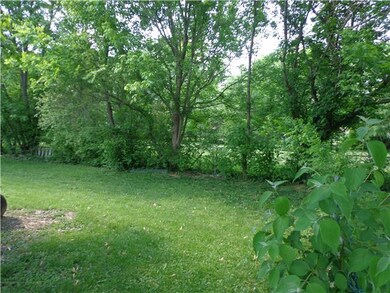 Lovely Backyard view from patio. Mature trees provide privacy.
