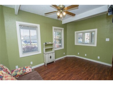 Spacious and bright living room with open beams.
