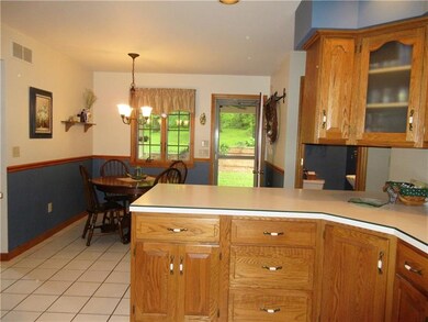 The eat-in kitchen has plenty of space for family 