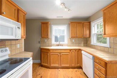 New dishwasher, lighting, plumbing fixtures and cabinet hardware