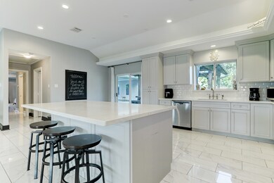 Large island surrounds is the focal point for this updated kitchen.