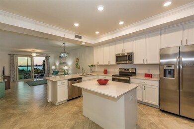 Large kitchen with can lighting and quartz counter