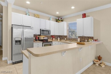 Kitchen with appliances with stainless steel finis