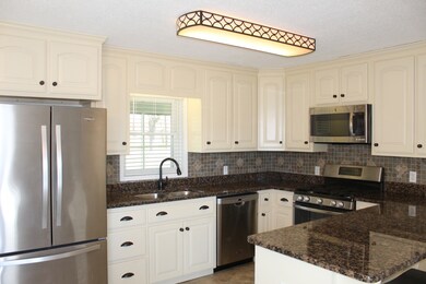 Granite counter tops and stainless appliances.