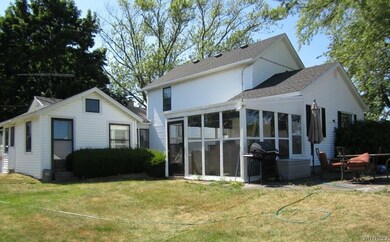 Rear of home. Comfortable South facing screened in