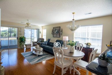 Dining space featuring a textured ceiling, visible