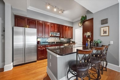 Kitchen with sink, stainless steel fridge, a kitch