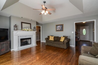Stylish colors, hardwoods, and fireplace make this an inviting place to relax.