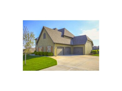 The home features a luscious well maintained lawn,