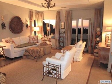 Living room with sunset ocean views.