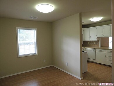 The dining are opens to the kitchen and new paint,