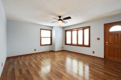 Spacious Living Room with Pella Windows that have 