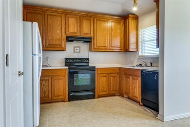 Kitchen featuring sink and black appliances