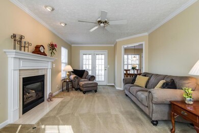 Large Family Room with fireplace, French door to oversize deck. 