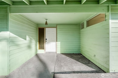 The covered entryway of this home is perfect for keeping out of the rain and snow.