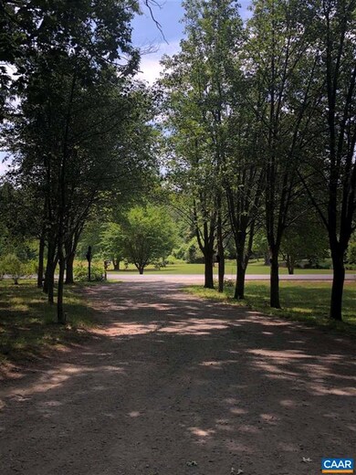 long circular, gravel driveway, with ample parking