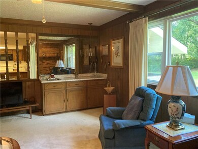 Wet bar in den with great view of backyard