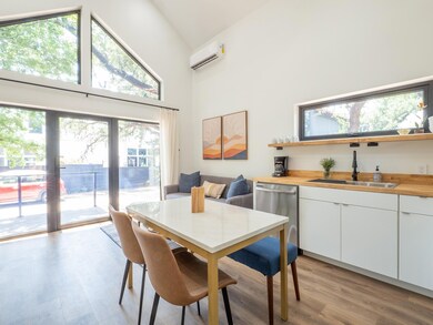 Dining area featuring a wall mounted air conditio