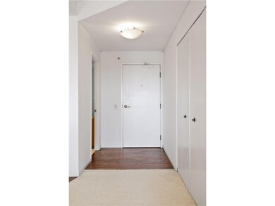 Hardwood floors in the foyer and kitchen.