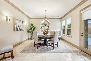 Dining space with an inviting chandelier and ornam