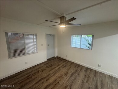 Great room with new fan and windows.