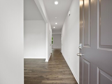 Belhaven plan front entryway open to a long hallwa