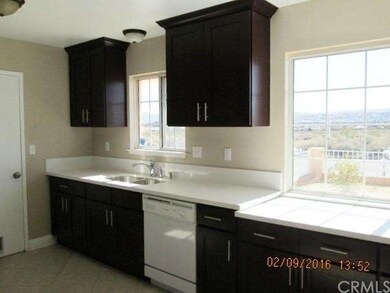 View of city from two windows. Nice Quartz counter