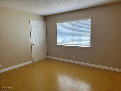 Spare room with light wood finished floors, basebo
