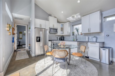 Kitchen featuring appliances with stainless steel