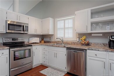Kitchen includes stainless appliances, built-in mi