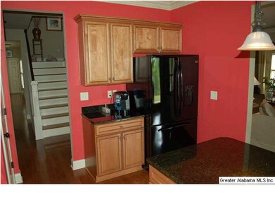 Kitchen features granite countertops and lots of l