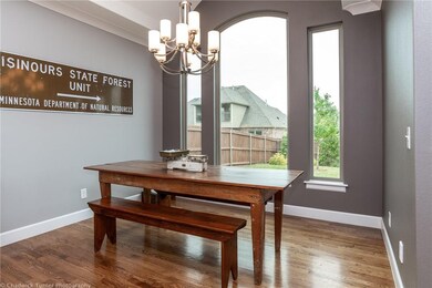 Spacious eating area overlooking the back yard.