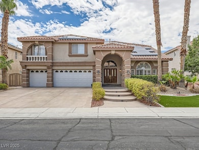 Mediterranean / spanish-style home featuring stucco siding, driveway, solar panels, and a tile roof