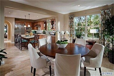 Open floor plan living and dining area (photo is o