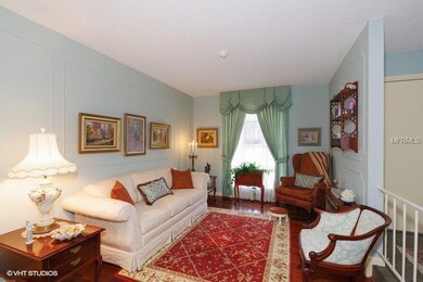 The sunken Formal Living Room has Hard Wood floors