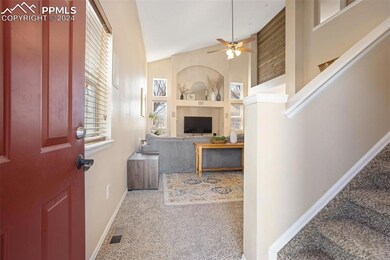 Living room with ceiling fan, carpet flooring, bui
