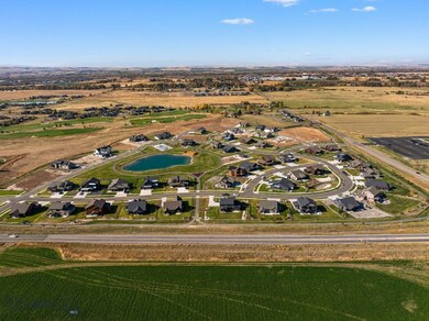 Aerial view featuring a rural view and a water vie