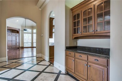 Butler's pantry off the entry hall is conveniently