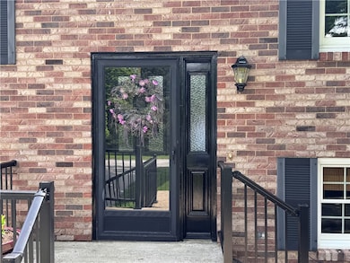 Welcome guests into the home from a spacious front