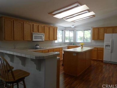 Bright and airy kitchen with breakfast bar and sky