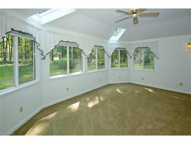 This Sunroom Has the Best View in the house.  Eight Double Windows look out over 