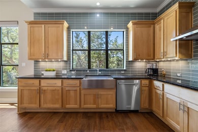 Kitchen featuring ornamental molding, dishwasher,