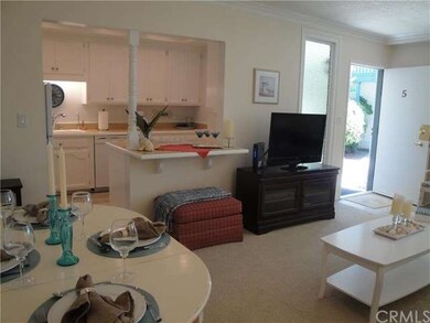 Living-dining room to breakfast bar and full kitch